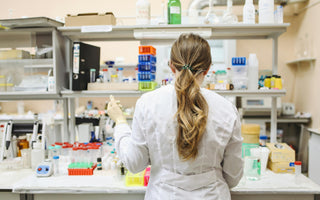 A lab technician preparing adherent cell samples