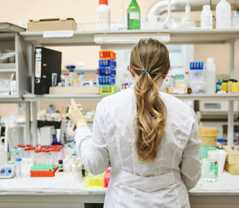 A lab technician preparing adherent cell samples