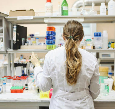 A lab technician preparing adherent cell samples